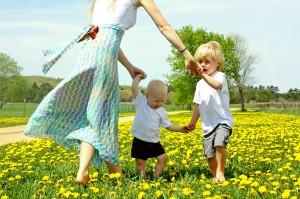 Children Playing Outside wiht Mother